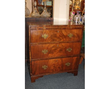 A Regency flame mahogany bachelors chest of three long drawers with brushing slide on bracket feet 76.5cm wide