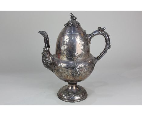 An unusual Victorian silver plated hot water jug in the form of an acorn, decorated in relief with oak leaves and acorns, the
