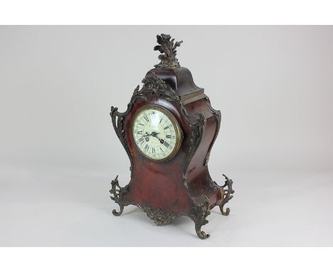 A 19th century French gilt metal mounted red tortoiseshell mantel clock with 11cm white enamel dial with Roman numerals, move