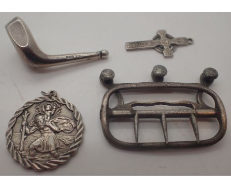 Four silver items, buckle, golf club head, St Christopher and Celtic cross 