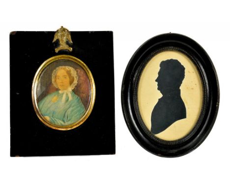 ENGLISH SCHOOL, EARLY 19TH CENTURY - PORTRAIT MINIATURE OF A YOUNG LADY IN LACE CAP AND BLUE DRESS, WATERCOLOUR ON CARD, OVAL