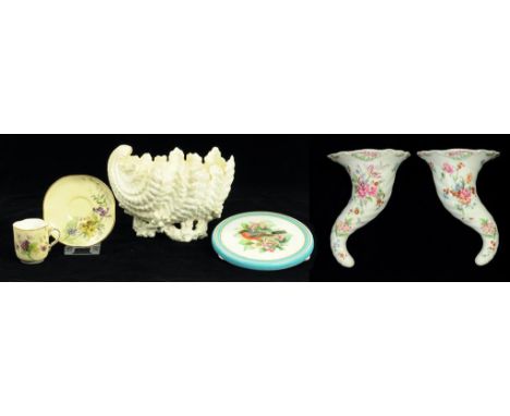 A ROYAL WORCESTER PRIMROSE GROUND COFFEE CUP AND SAUCER WITH GILT SNAKE HANDLE AND DECORATED WITH VIOLETS, SAUCER 11.5CM DIAM
