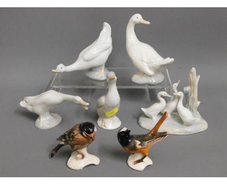 A quantity of Nao, Lladro &amp; one unsigned porcelain geese, one with tail repair twinned with two Goebel birds