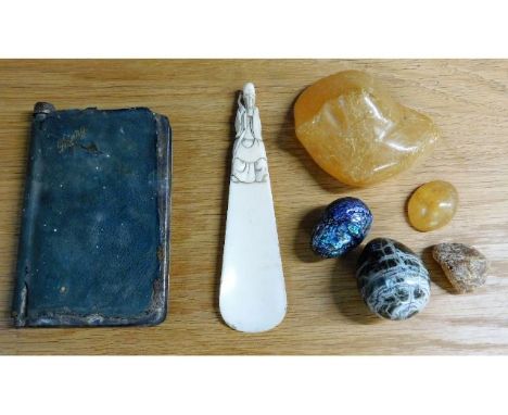 A c.1900 Oriental ivory shoehorn, three pieces of amber, one 4in wide, two eggs &amp; a 1920's novelty electroplated and leat