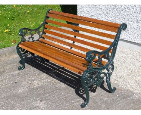 A modern garden bench with cast iron ends, 49.5in wide