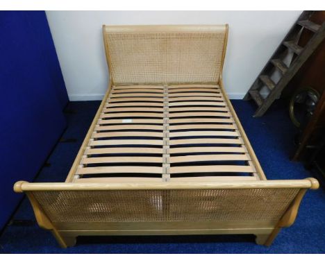 A good quality, clean light oak &amp; cane double sleigh bed, cost approx. £1200 new