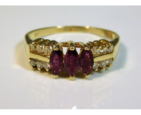 A 14ct gold ring set with diamond &amp; ruby, size N, 3g