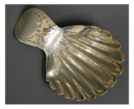 A 1786 George III shell shaped London silver caddy spoon, rubbed mark, possibly by William Eley, 6.6g