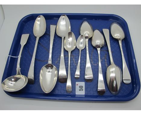 A Matched Set of Four Hallmarked Silver Hanoverian Pattern Spoons, bottom struck; together with three hallmarked silver table