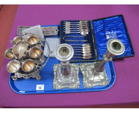 A Set of Twelve Elkington &amp; Co Plated Teaspoons, each detailed with a sundial, with matching sugar tongs, in original "Su