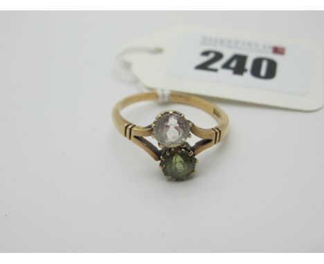 A Two Stone Ring, of crossover style, claw set between bifurcated shoulders, stamped "15ct" (finger size R) (2.8grams).  