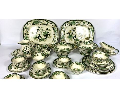 A large and comprehensive Mason’s Ironstone dinner service, Chartreuse pattern, decorated with green roses and scrolls with g