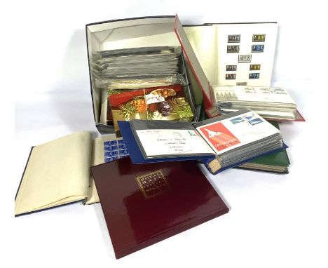 A box containing assorted stamps, including first day covers etc. (a lot)