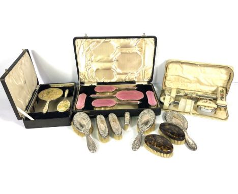 Assorted vanity cases, including cased enamel and silver backed hair brushes etc, once with pink enamel, another with marbled