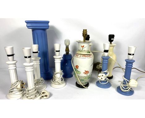 A quantity of modern table lamps, including a pair of light blue column ceramic lamp stands, another white pair and other ite