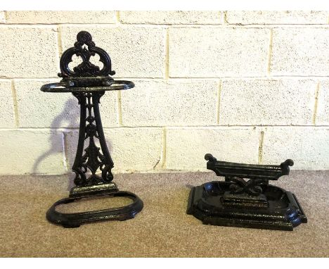 A Victorian cast-iron stick stand, together with a similar cast-iron boot scraper