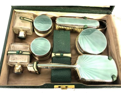 A vintage green leather travelling case, and matching vanity case, with silver and enamel by Walker &amp; Hall, hallmarked Bi