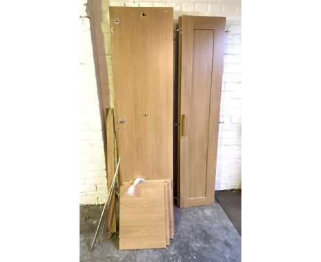 A modern double wardrobe, flat-packed, light oak veneer