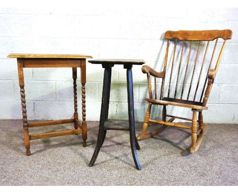 A modern comb backed rocking chair, with eight spindles, together with a small occasional table and plant stand (3)