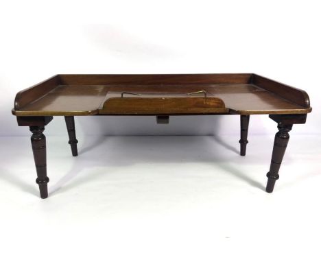 A small Victorian lap table, with three quarter gallery, hinged slope and short turned legs, 69cm wide, 38cm deepPerfect for 