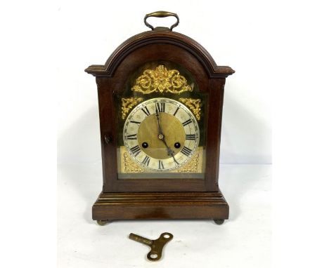 George III style table clock, circa 1900, in an arch top case, with a silvered chapter ring, the twin barrel movement strikin