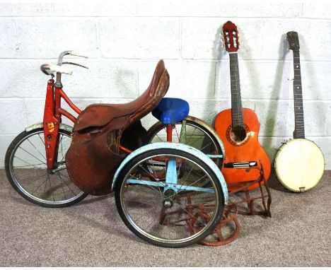 A small leather saddle with wrought iron saddle rack and bridle rack; together with a small child’s Sunbeam Winkie tricycle, 