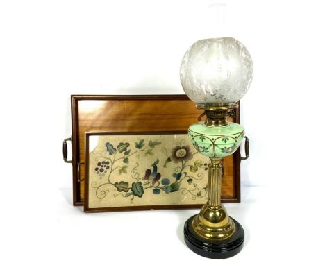 A Victorian brass and ceramic oil lamp, with clear etched glass shade; together with two serving trays (3)