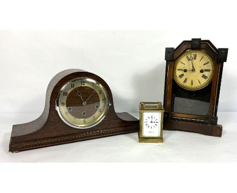 A Mappin &amp; Webb brass cased carriage clock, 15cm high; together with two small mantel clocks and a Continental walnut cas