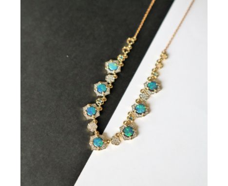 Gemporia - A crystal opal on ironstone, Marambaia London blue topaz and white zircon 9k gold Tomas Rae necklace