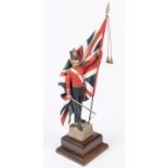 A good Charles Stadden figurine of an infantry officer c 1854 with Regimental Colours, height 13",