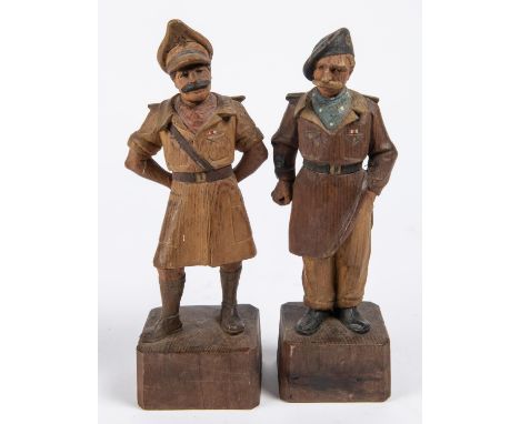 A most unusual pair of carved wood figures: The Two Types, the famous WWII cartoon army officers, height 10", dressed as in t
