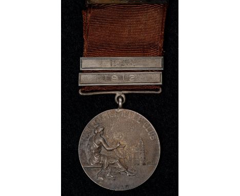 War Office Rifle Club medal for "The Sister Agnes Challenge Cup" awarded to A.J. Madgin, piece diameter 30mm, the riband with