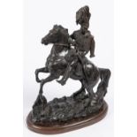 A bronzed composition equestrian figure of an early 19th century French hussar wearing shako with