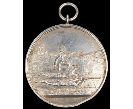 "Wickham Bishops Rifle Club" silver shooting medal, obverse 2 military personnel prone firing at a rifle range with adjudicat