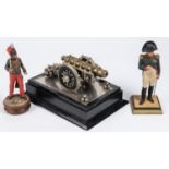 A figure of Napoleon, 6¾", painted metal with wood base; another similar of a Crimean period British