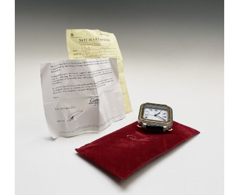 A Cartier Santos alarm clock no. 7508 04700 with Quartz movement Condition: Sold with pouch and a Cartier repair docket. It t