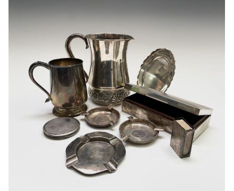 A collection of Indian silver comprising a repouse pitcher 473gm, a pint mug (inscribed) 347gm, a pair of ashtrays 134gm, a s