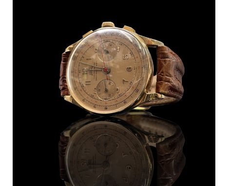 An Egona 18ct gold chronograph wristwatch with pink dial and 17 jewel movement Diameter 36.9mm, 48.9gm including strap.
Condi