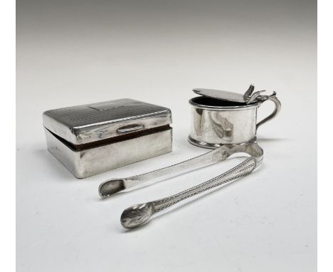 An engine-turned small cigarette box, a pair of Georgian silver sugar tongs and an epns mustard with silver spoon
There is no