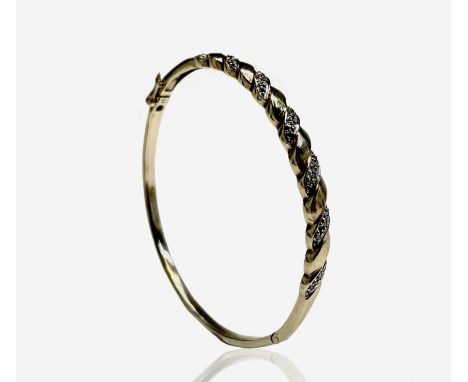 A 9ct gold bangle set with diamonds 9.9gm Condition: Good used condition UK Postage: £17.04