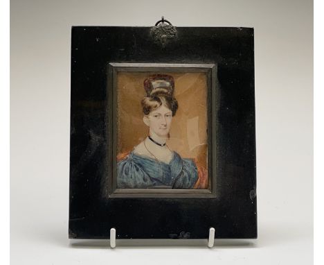 A miniature portrait of a Regency lady with piled coiffure 9x7cm Condition: The glass is broken and so dirt has got to the su
