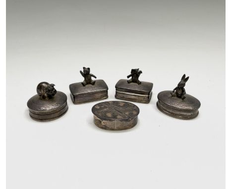 A group of three Elizabeth II silver pillboxes by Ari D Norman, the lid of each with an articulated animal, one other pillbox