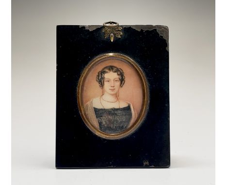 Miniature portrait of a young lady, her hair in ringlets 7.5x6cm Condition: Not examined out of the frame but there are no ap