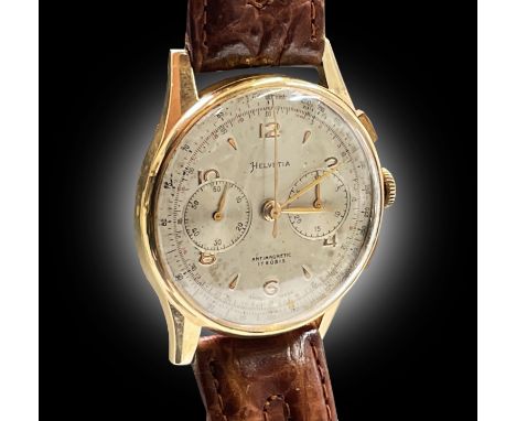 An Helvetia 18ct gold cased chronograph wristwatch with 17 jewel movement. Diameter 37.5mm, 50gm including strap.
The Phil Wa