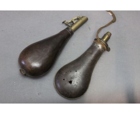 Dixon &amp; Sons a brass and leather shot flask, marked Dixon &amp; Sons.  Length 23 cm, together with a G &amp; J.W. Hawksel