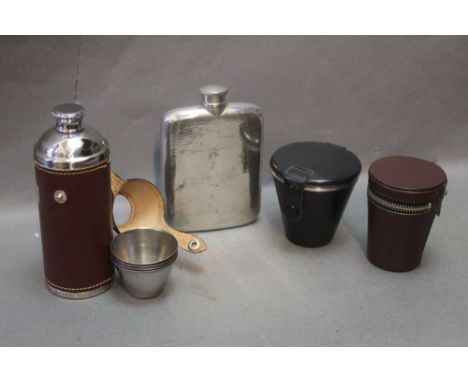 A hip flask together with two cup sets and a cup and flask set.