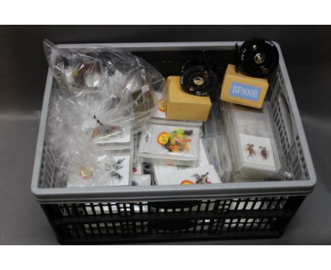 Twenty fly boxes with flies, 12 fly boxes with salmon flies, 2 fly reels BF800's, 5 Tiemco fly tying tools and 50 Fulling Mil