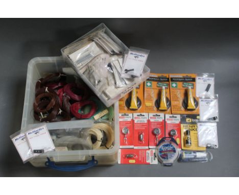 Two plastic boxes filled with fly lines, McHardys of Carlisle fly tying tools, Neoprene repair kits etc.