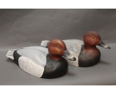 Stewart Males, two wooden carved decoy ducks, Pochard, the first 33 cm tail to beak marked to bottom 1985, the second 32 cm m