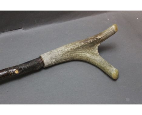 A Red Stag antler handled walking stick, with twisted shaft, height 124 cm.